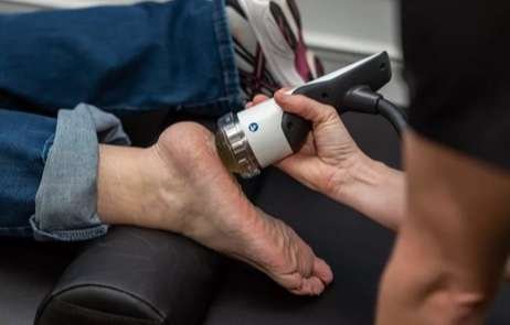 Dr. Addison providing Shockwave Therapy in Kennesaw
